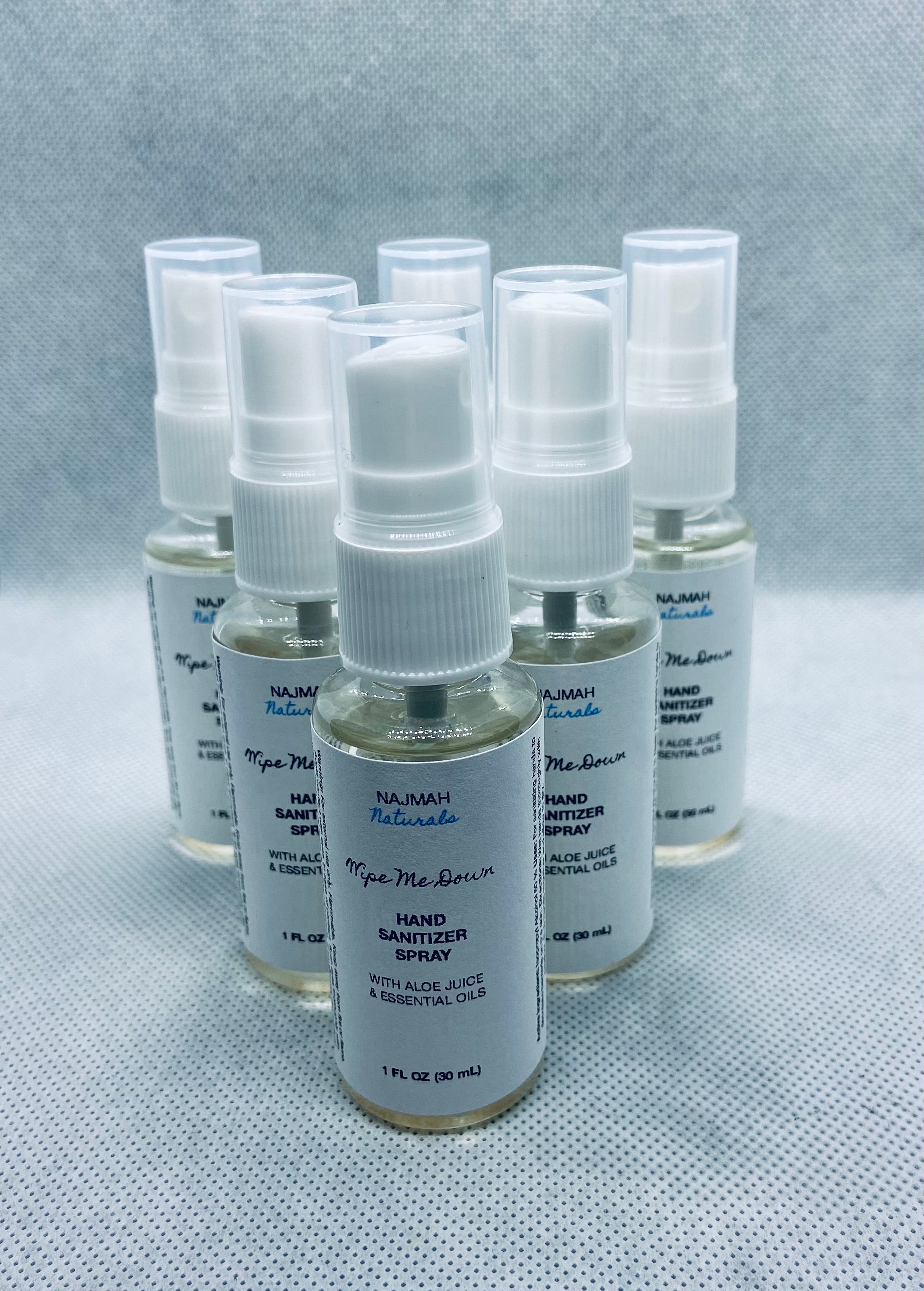 Our Wipe Me Down Hand Sanitizer Spray contains aloe vera juice, 99% isopropyl alcohol, and premium essential oils. This price includes five 1 ounce spray bottles. They are the perfect size to toss in your pocket or bag before you leave the house. 